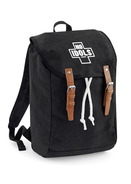 A black canvas backpack with a white 'NGI IDOLS' logo on the front flap, brown leather strap accents, and a white drawstring, shown on a plain white background.