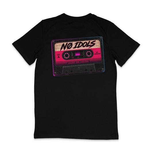 A black short-sleeve t-shirt with a retro cassette tape graphic on the chest. The cassette features a pink and beige label with the text 'NO IDOLS' in black script, and 'BONNIE RIDE ENTERTAINMENT' printed below.