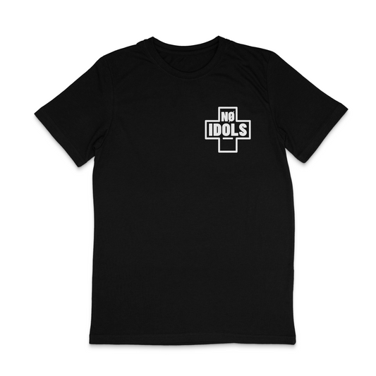 A black short-sleeve crewneck t-shirt with a white graphic on the left chest featuring a cross shape and the words 'NO IDOLS' inside, shown on a plain white background.